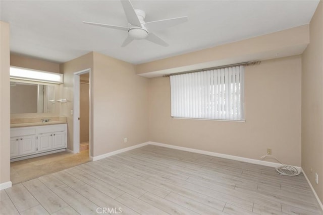 2692 N Fernside St, Orange, CA 92865 - unfurnished bedroom featuring light wood-style flooring, ensuite bathroom, and a ceiling fan