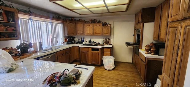 45342 State Highway 74, Hemet, CA 92544 - kitchen featuring tile counters, stainless steel dishwasher, brown cabinets, and wood finished floors