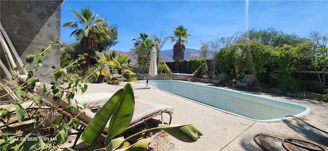 45342 State Highway 74, Hemet, CA 92544 - view of pool with a fenced backyard, a mountain view, and a patio