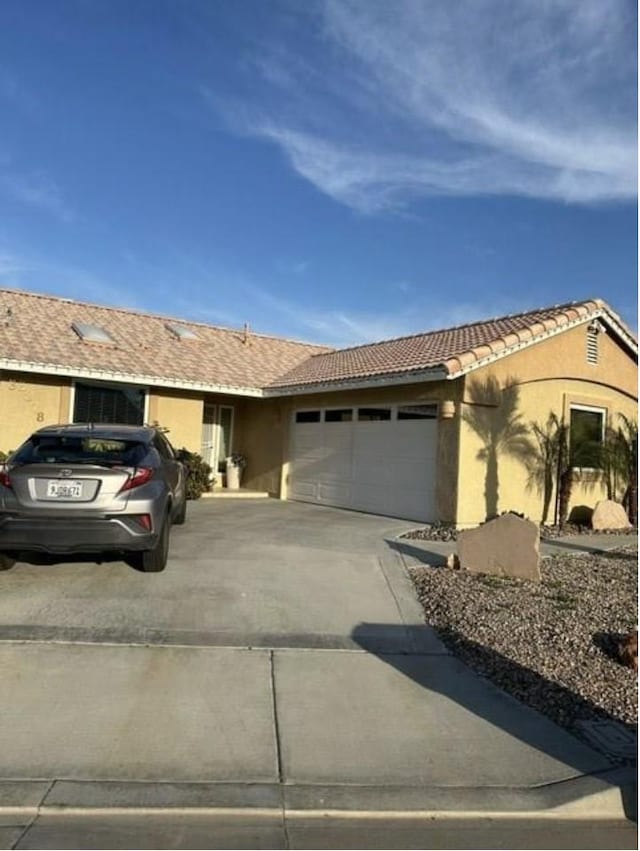 33878 Drifting Sands Cir, Thousand Palms, CA 92276 - ranch-style home with concrete driveway, a garage, stucco siding, and a tile roof