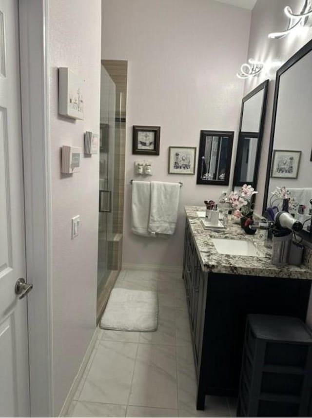 33878 Drifting Sands Cir, Thousand Palms, CA 92276 - bathroom with double vanity, a stall shower, and marble look tiles