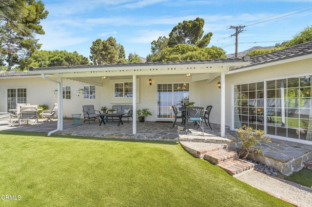 2302 Jayma Ln, La Crescenta, CA 91214 - back of property featuring stucco siding, a patio, and a lawn