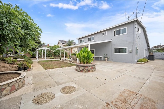 239 N Basilio Ave, San Dimas, CA 91773 - rear view of property featuring a patio and stucco siding