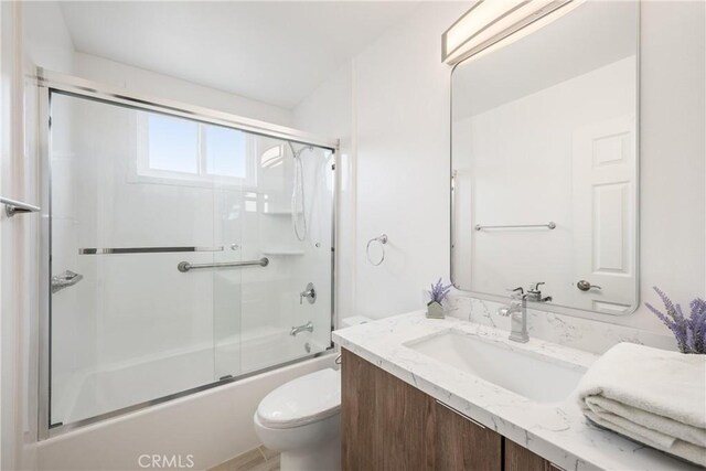 239 N Basilio Ave, San Dimas, CA 91773 - bathroom featuring vanity and combined bath / shower with glass door