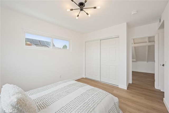 239 N Basilio Ave, San Dimas, CA 91773 - bedroom featuring light wood-style floors and a closet