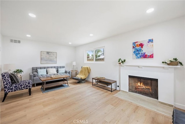 239 N Basilio Ave, San Dimas, CA 91773 - living area with wood finished floors, recessed lighting, and a fireplace with flush hearth
