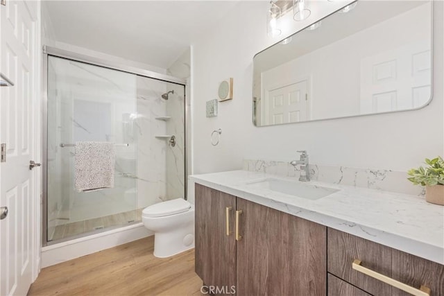 239 N Basilio Ave, San Dimas, CA 91773 - full bathroom featuring vanity, a marble finish shower, and wood finished floors