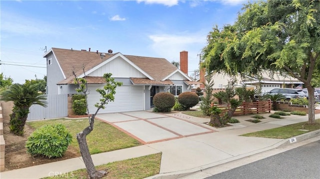 239 N Basilio Ave, San Dimas, CA 91773 - view of front of property featuring driveway, an attached garage, and roof with shingles