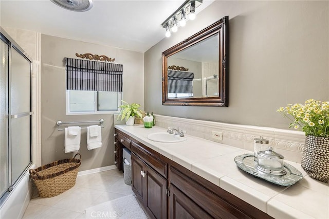 8841 White Oak Ave, Sherwood Forest, CA 91325 - bathroom featuring double vanity, tile patterned floors, and enclosed tub / shower combo