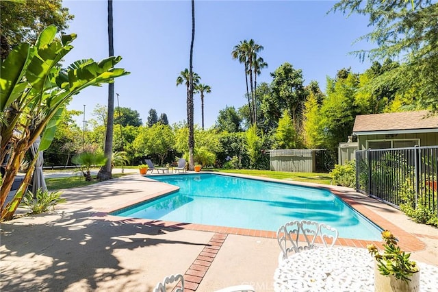 8841 White Oak Ave, Sherwood Forest, CA 91325 - view of pool featuring a patio area and view of wooded area