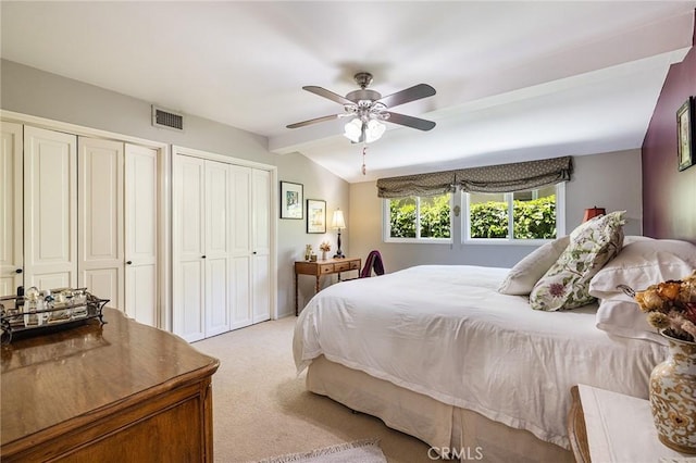 8841 White Oak Ave, Sherwood Forest, CA 91325 - bedroom featuring light carpet, multiple closets, beam ceiling, and a ceiling fan