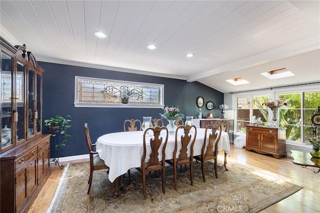 8841 White Oak Ave, Sherwood Forest, CA 91325 - dining space with crown molding, recessed lighting, light wood-type flooring, and a skylight