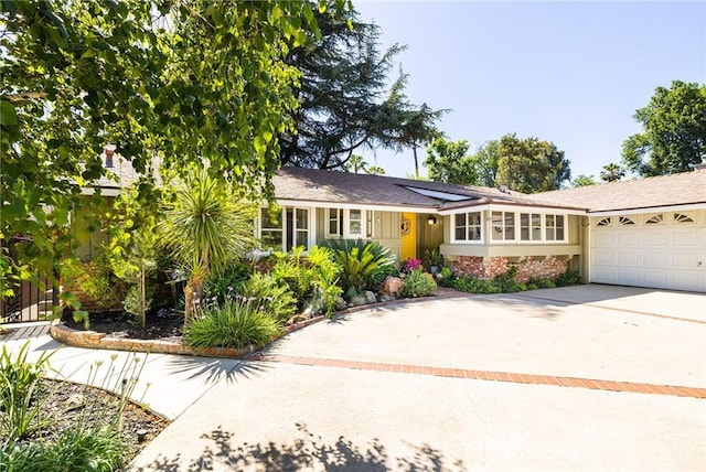 8841 White Oak Ave, Sherwood Forest, CA 91325 - single story home with driveway and an attached garage