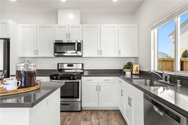 956 Pico Pl, Chico, CA 95928 - kitchen with appliances with stainless steel finishes, white cabinets, dark countertops, and recessed lighting