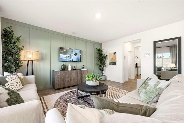 956 Pico Pl, Chico, CA 95928 - living room with a decorative wall and light wood-style floors