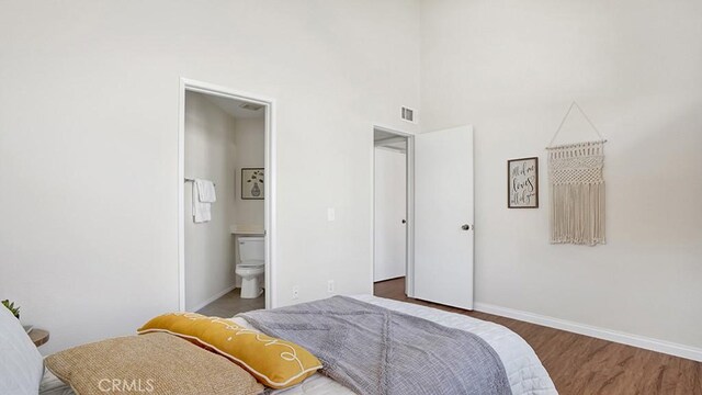 13133 Le Parc Unit 503, Chino Hills, CA 91709 - bedroom with wood finished floors, ensuite bath, and a towering ceiling