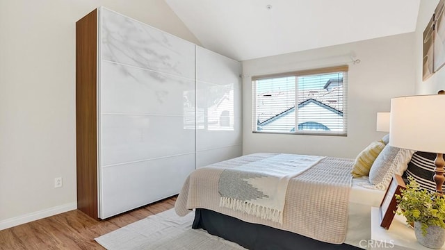 13133 Le Parc Unit 503, Chino Hills, CA 91709 - bedroom featuring wood finished floors, vaulted ceiling, and a closet