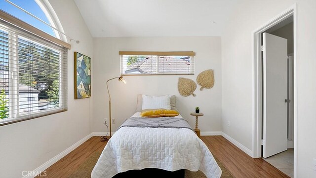 13133 Le Parc Unit 503, Chino Hills, CA 91709 - bedroom featuring multiple windows, wood finished floors, and lofted ceiling
