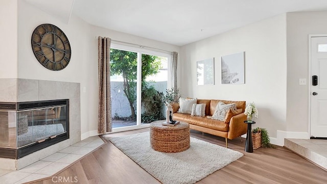 13133 Le Parc Unit 503, Chino Hills, CA 91709 - living room with light wood-style floors and a tiled fireplace