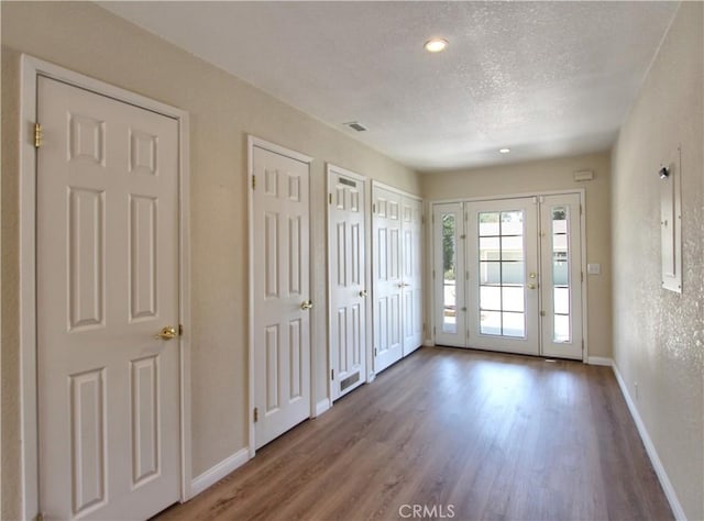 1023 Fremont St, Calimesa, CA 92320 - unfurnished bedroom with wood finished floors, access to exterior, a textured ceiling, and recessed lighting