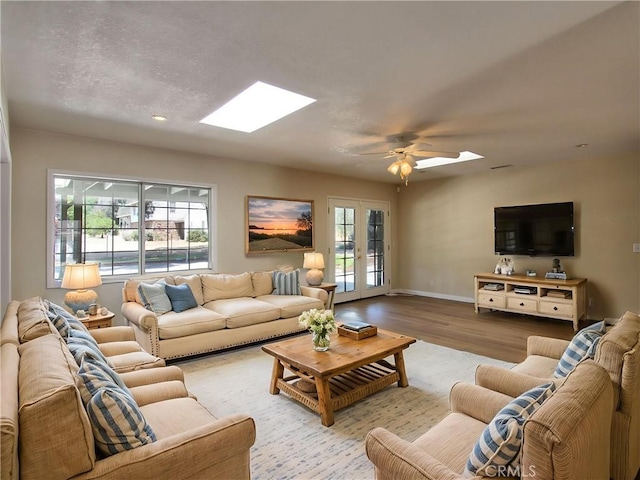 1023 Fremont St, Calimesa, CA 92320 - living area featuring a skylight, wood finished floors, french doors, a ceiling fan, and recessed lighting