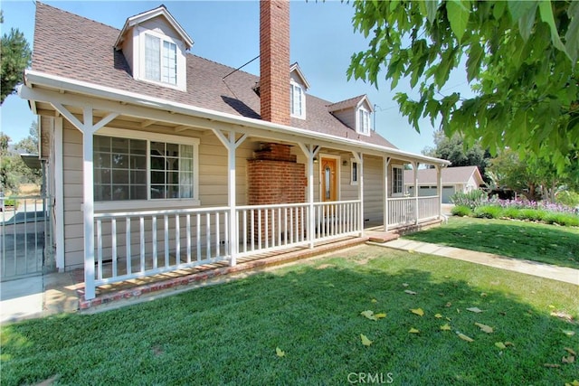 1023 Fremont St, Calimesa, CA 92320 - view of front facade featuring a porch, a chimney, a front yard, and a shingled roof