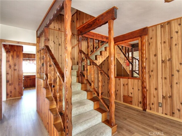 1023 Fremont St, Calimesa, CA 92320 - stairway featuring wood finished floors and wood walls