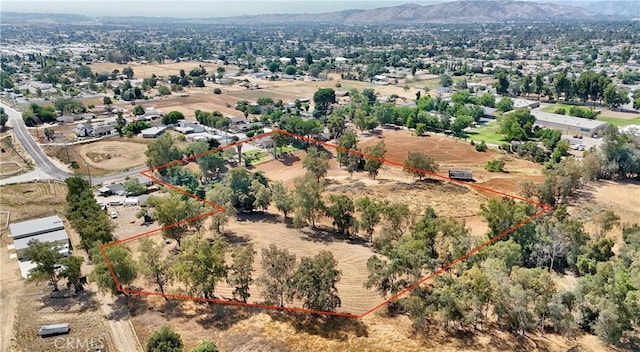 1023 Fremont St, Calimesa, CA 92320 - aerial overview of property's location with property boundaries highlighted and a mountain backdrop