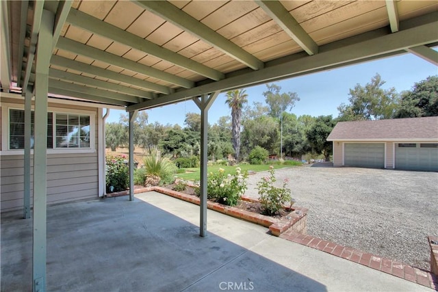 1023 Fremont St, Calimesa, CA 92320 - view of patio with view of wooded area and an outbuilding