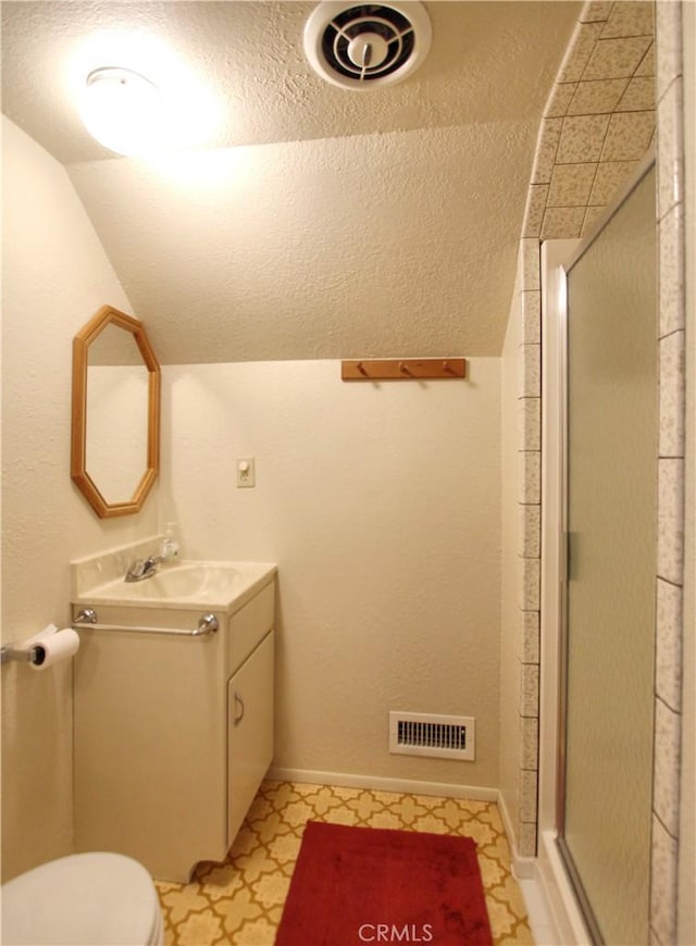 1023 Fremont St, Calimesa, CA 92320 - bathroom featuring tile patterned floors, a shower stall, vanity, and vaulted ceiling