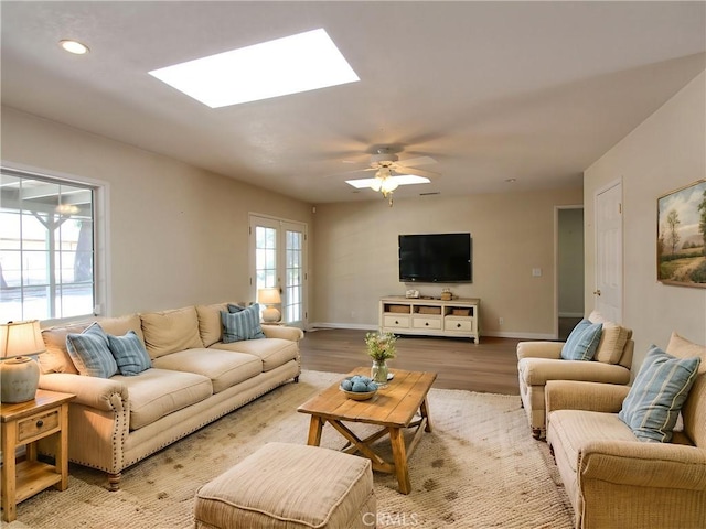 1023 Fremont St, Calimesa, CA 92320 - living room featuring a skylight, light wood-style floors, a ceiling fan, and recessed lighting