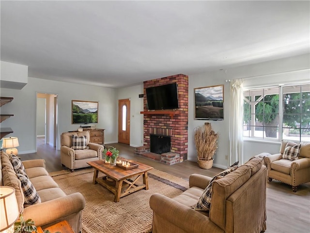 1023 Fremont St, Calimesa, CA 92320 - living room with light wood-style flooring and a fireplace