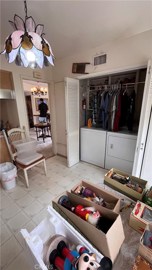 14020 Avion Dr, La Mirada, CA 90638 - living area featuring independent washer and dryer, a chandelier, and lofted ceiling