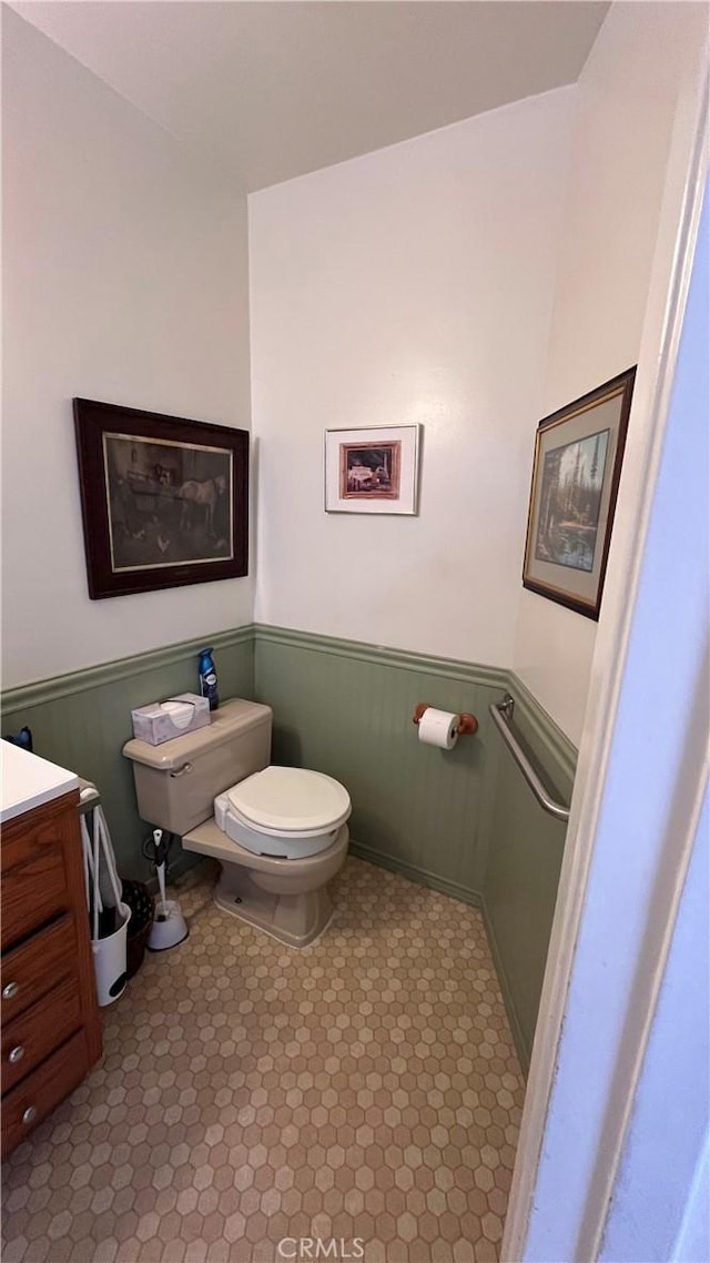14020 Avion Dr, La Mirada, CA 90638 - half bathroom featuring a wainscoted wall and vanity