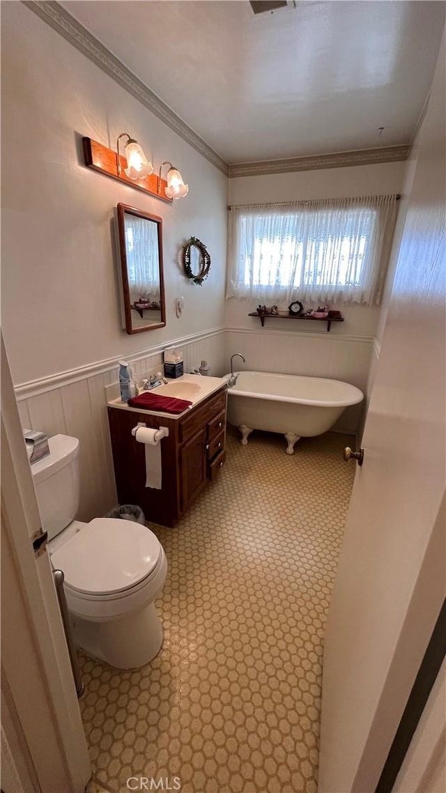 14020 Avion Dr, La Mirada, CA 90638 - full bathroom featuring a soaking tub, vanity, a wainscoted wall, and crown molding