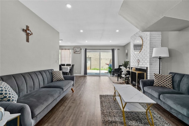13948 Dawson St, Garden Grove, CA 92843 - living area with wood finished floors, recessed lighting, and a fireplace