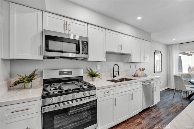 13948 Dawson St, Garden Grove, CA 92843 - kitchen with appliances with stainless steel finishes, white cabinetry, light stone counters, and recessed lighting