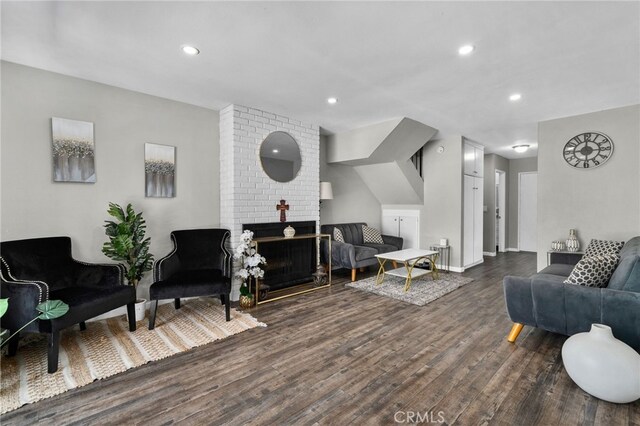 13948 Dawson St, Garden Grove, CA 92843 - living room featuring dark wood-style flooring, recessed lighting, and a fireplace