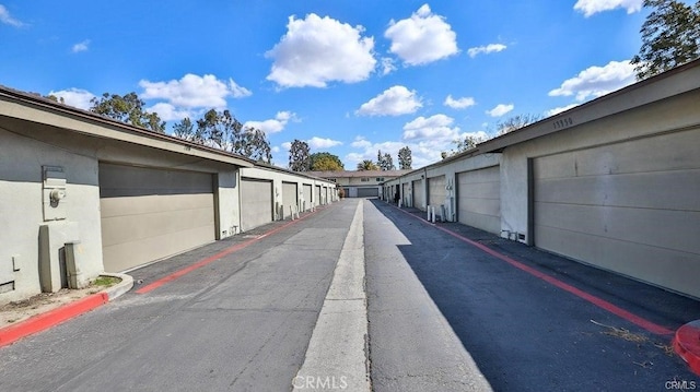 13948 Dawson St, Garden Grove, CA 92843 - view of asphalt road featuring community garages