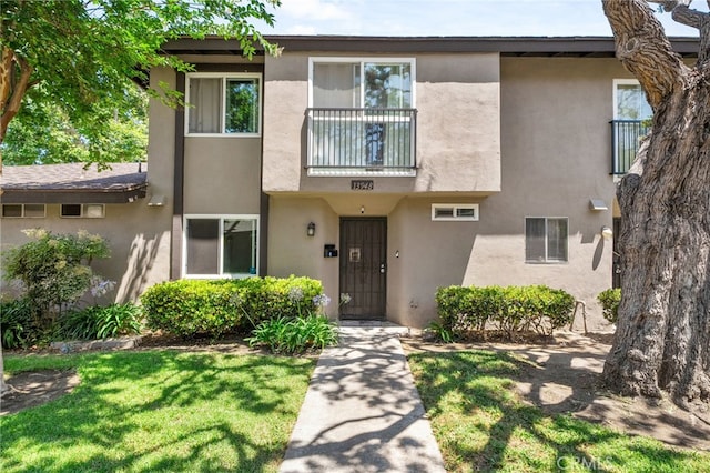 13948 Dawson St, Garden Grove, CA 92843 - townhome / multi-family property featuring stucco siding and a front yard