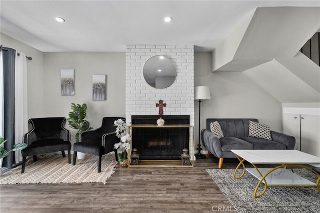 13948 Dawson St, Garden Grove, CA 92843 - living room featuring wood finished floors, recessed lighting, and a brick fireplace