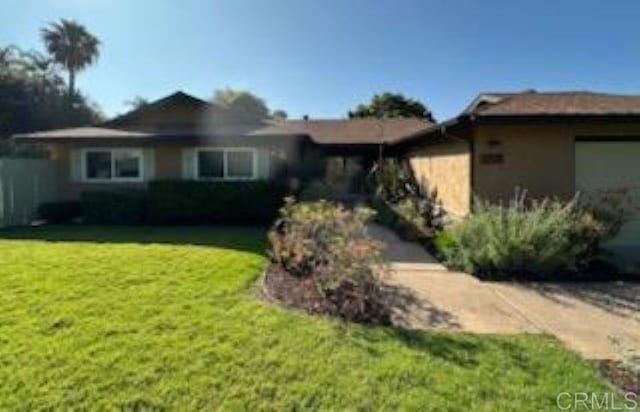 3625 Laketree Dr, Fallbrook, CA 92028 - view of front of house with a front lawn, an attached garage, and stucco siding