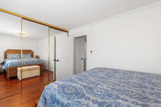 1833 Stonebrook Ln, Encinitas, CA 92024 - bedroom featuring ornamental molding, wood finished floors, and a closet