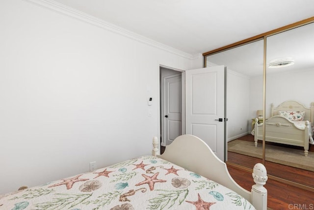 1833 Stonebrook Ln, Encinitas, CA 92024 - bedroom featuring a closet, wood finished floors, and crown molding