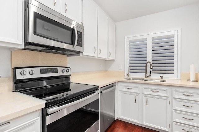 1833 Stonebrook Ln, Encinitas, CA 92024 - kitchen featuring stainless steel appliances, white cabinets, light countertops, and dark wood-type flooring