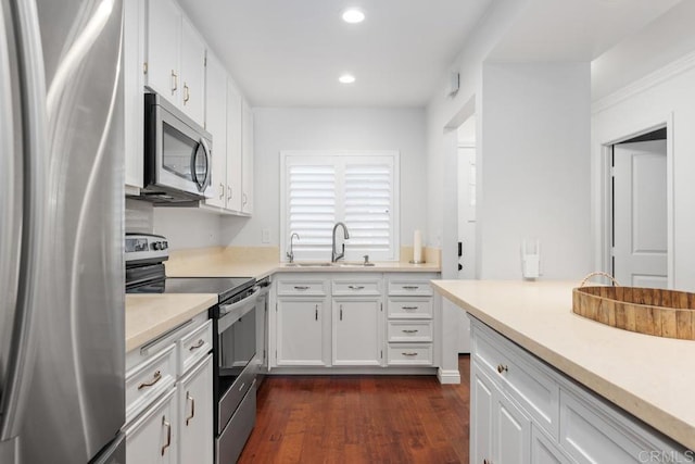 1833 Stonebrook Ln, Encinitas, CA 92024 - kitchen featuring stainless steel appliances, recessed lighting, light countertops, dark wood finished floors, and white cabinets