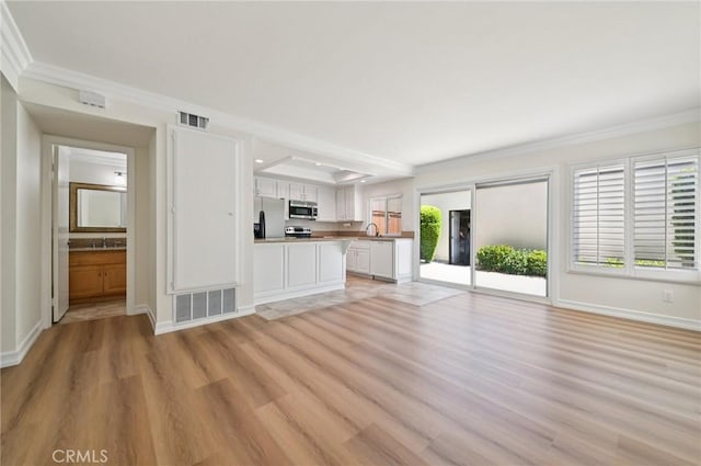 1984 Mount Shasta Dr, San Pedro, CA 90732 - unfurnished living room with light wood-style floors and crown molding