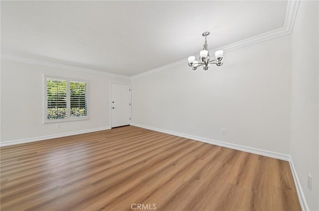 1984 Mount Shasta Dr, San Pedro, CA 90732 - empty room featuring a chandelier, crown molding, and light wood-style floors