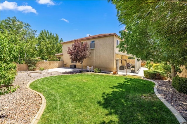 45749 21st St W, Lancaster, CA 93536 - back of property with stucco siding and a patio