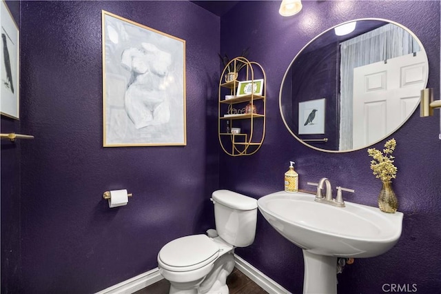 45749 21st St W, Lancaster, CA 93536 - bathroom with baseboards and wood finished floors